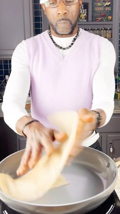 a man is making food in a pan