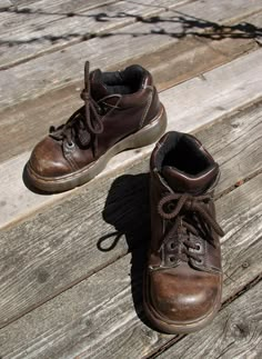 Classic low rise boots by Doc Martens, made in England.  10 eye laceups, thick rubber soles, made for standing on concrete floors for long shifts.  Very good condition, moderate signs of wear.  Insoles are cracked.  See detail photos. Marked men's UK size 6.  Corresponds with US size 6.5, European size 38.5.  Should correspond to women's UK size 6, US size 8.5, European size 39.  See measurements. Measurements: 11-1/8 inches (28 cm) long from toe to heel, measured outside 10 inches (25.5 cm) long from toe to heel, measured inside 4-1/4 inches (11 cm) wide at ball of foot, measured inside 1-3/4 inch (4.5 cm) heel height These are over 20 years old, have been worn, and are sold as is.  Please note measurements, as you are responsible for determining fit.  I do not accept returns for sizing o Doc Martens Homme, Laceup Boots, Classy Outfits Men, Detail Photos, Cocoa Brown, Mens Shoes Boots, La Pointe, Dream Shoes, Doc Martens