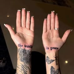 two hands with tattoos that say the truth is yours and butterflies on their palms,