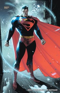 superman standing in the rain with his red cape over his shoulder and hands on his hips