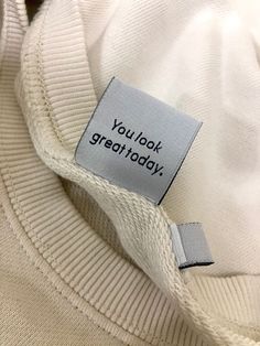 a label on a white sweater that says you look great today with the words'you look great today '