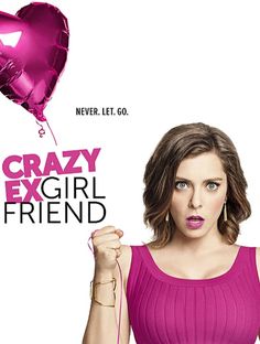 a woman in a pink dress holding a heart shaped balloon with the words crazy girl friend written on it