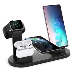 an apple watch, ear buds and charging station