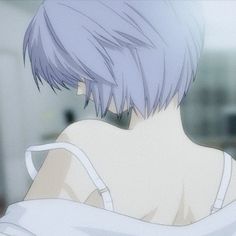 the back of a person's head with short purple hair and white shirt on