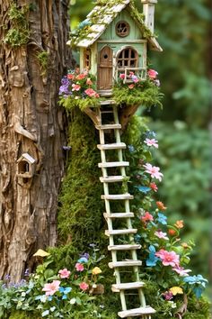 a tree house made out of plants and flowers with a ladder to the upper floor