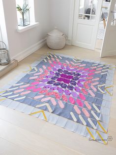 a colorful rug is sitting on the floor