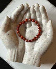 "Red Jasper Evil Eye Stretch Bracelet-- **Red Jasper** The stone of strength and stability. Red Jasper enhances your physical strength and stamina... It connects you to the earths energies and grounds you into your awareness. Red Jasper is also known as the \"Warrior Stone of Courage. This is a protection stone. It brings tranquility and holiness to the wearer. This is a Made to Order Item Therefore, you will not receive the exact bracelet featured in the photo. **Sizing Details** Ladies Small....6\"-7\" Ladies Medium....7\"-8\" Ladies Large....8\"-9\" To Measure: Using a tape measure, go just below the wristbone and choose the size closest to your \"exact\" measurement. I will add up for a comfortable fit. So please choose your exact wrist size to ensure you get the best fit possible. **N Red 8mm Beads Healing Jewelry, Red Bracelet For Protection, Red Jasper Bracelet, Red Jasper Pendant, Red Jasper Stone, Physical Strength, The Warrior, Protection Bracelet, Protection Stones