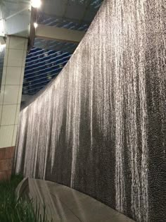 the water is running down the side of the building and it's lights are on