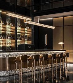 an elegant bar with stools and lights