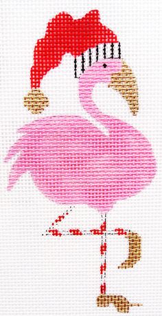 a pink flamingo with a santa hat on it's head