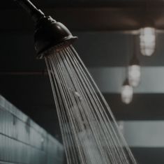 a shower head with water flowing from it