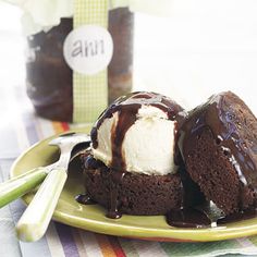 two chocolate desserts with ice cream on a plate