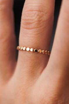 This stacking ring is perfect for mixing and matching! Either wear several at once or mix some in with your favorite rings for extra width and sparkle! This new version of the Bead Ring is slightly more durable than its predecessor! This listing is for ONE SINGLE ring.This ring is made out of 14K GOLD FILL metal.The finish is lightly faceted/hammered.* The photos show this new Mini Bead Ring style compared to our Original Bead Ring! Each Mini Bead Ring is individually cut, soldered and polished Single Ring, Stacking Ring Set, New Version, Beaded Rings, Favorite Rings, Wide Bands, Stacking Ring, Stackable Rings, Cleaning Jewelry