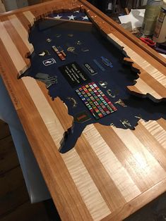 a wooden table that has been made to look like the state of michigan on it