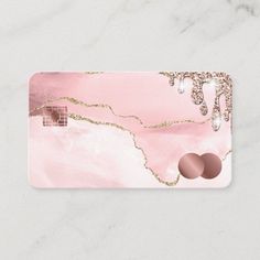 a pink marble business card with gold glitter accents