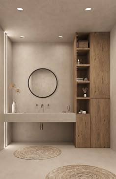 a bathroom with two round rugs on the floor and a sink in the middle