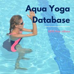 a woman in a pink and black swimsuit standing in the water with her arms up