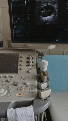 an image of a medical machine with the monitor on it's side and other equipment in front of it