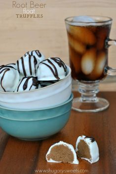 there is a bowl of hot chocolate truffles next to a cup of coffee