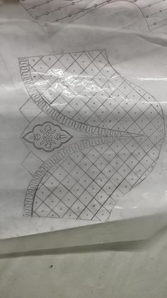 a paper bag with an image of a bird on it's side and some lines drawn in the middle