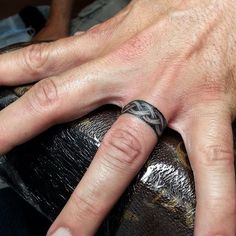 a person's hand with a wedding ring on top of it and the words amazing designs for couples