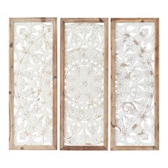 three panels with intricate designs on them, one in white and the other in beige