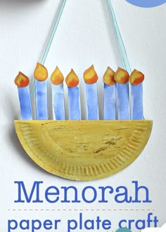 the paper plate craft is made to look like a menorah