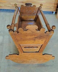 an old wooden rocking chair sitting on the floor