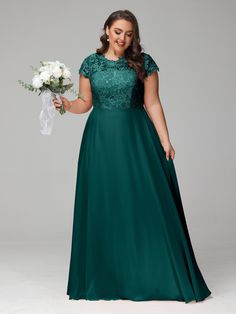 a woman in a long green dress holding a bouquet