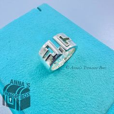 In Pristine Condition. Kept In Tiffany Blue Box, Blue Pouch And White Satin Ribbon, Ready For Gifting. Perfect Unisex Ring. This Is An Authentic Tiffany & Co. 925 Silver T Cutout Stencil Ring. Ring Width Is Approximately 10mm. Ring Is Size Us 6. Dime For Size Comparison. Please See All Photos And Video On This Beautiful Piece. Comes With Tiffany Blue Box, Blue Pouch And White Satin Ribbon. If You Have Any Questions, Please Ask :) Mens Tiffany Rings, Tiffany Blue Box, Box Pouch, Blue Box, Size Comparison, Mens Accessories Jewelry, Unisex Ring, Tiffany Blue, Ring Band