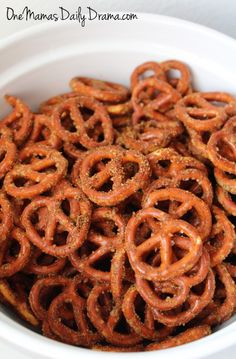 a bowl filled with onion rings on top of a table