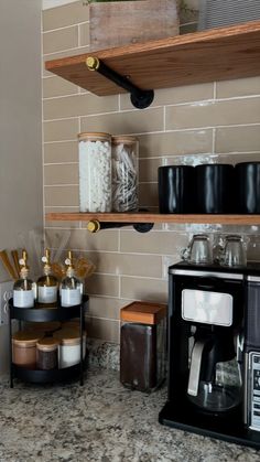 the kitchen counter is clean and ready to be used as a coffee bar or breakfast bar