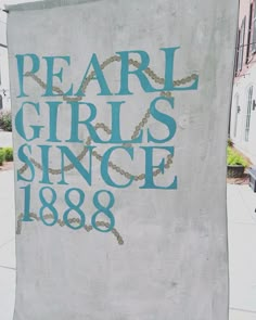 a sign on the side of a building that says pearl girls since 1908