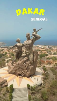 an aerial view of a statue with the words dakar in front of it,