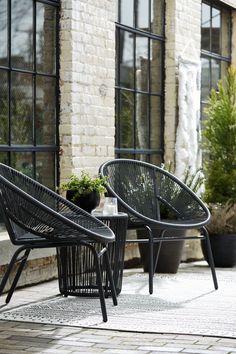 Treat yourself to trend-right outdoor design with this table and chair set. It elevates your patio, deck or poolside seating area with sleek resin wicker over a durable powder coated steel frame. The included end table with an aluminum top keeps your essentials for everyday relaxation within reach. Mandarin Cape - Gray - Chairs W/Table Set (Set of 3)26.5"W x 27.88"D x 31.25"H - 41.0 lb Mandarin Cape - White - Chairs W/Table Set (Set of 3)26.5"W x 27.88"D x 31.25"H - 40.0 lb Front Patio Furniture Ideas, Balcony Chairs And Table, Backyard Table Ideas, Deck Seating Ideas, Decking Furniture, Poolside Seating, Outdoor Table Set, House Moodboard, Backyard Table