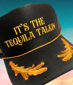 "Welcome to our Etsy listing for the \"It's the Tequila Talkin' Black and Gold Captain Sailor Trucker Hat\"! This statement-making trucker hat is perfect for those who love tequila and want to make a stylish impact. With its black and gold color combination, this hat stands out from the crowd. The captain sailor design adds a touch of nautical flair, making it a unique and eye-catching accessory. Made with high-quality materials, this hat is not only fashionable but also comfortable to wear. The adjustable strap ensures a perfect fit for all head sizes. Express your love for tequila and showcase your fun-loving spirit with this must-have hat. Whether you're hitting the beach, partying with friends, or simply enjoying a night out, this hat is the perfect companion. It's also a fantastic gif Trucker Hat Bar, Diy Hats, Captain Cap, Fun Hats, Trucker Hat Black, Gold Color Combination, Custom Bachelorette, Custom Trucker Hats, Sailor Hat