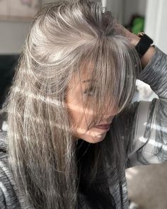 I love seeing how many women are embracing their gray hair and sharing their journeys on social media. As women, we tend to have unrealistic expectations for ourselves, in all areas of our lives, and this carries over into our hair. But, the fact is, pretty much all of us will go gray at some Going Gray In Secret, Silver Hair Ideas For Brunettes, Gray Hair Blonde Highlights, Smokey Hair Color Gray, Gray Blended Hair, Hide Gray Hair, Blonde Hair Going Grey, Smokey Hair