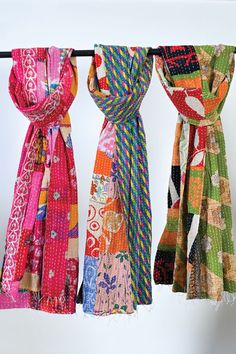 "Our Patchwork Kantha Scarves are handmade by women artisans in West Bengal, India using 100% cotton up-cycled saris. Each piece is unique and is made from saris that are intricately stitched together using the traditional \"kantha\" embroidery technique. This artistic scarf features a beautiful patchwork design on one side and a unique sari design on the other side, with soft fringe finish at the ends. Sevya's handmade kantha scarves are works of art and showcase the rich textile crafts of eastern India. Comes in assorted colors and prints. Dimensions: 18\" x 70\"" Susan Eastman, Traditional Multicolor Festive Scarves, Patchwork Scarf Folksy, Artsy Handmade Multicolor Scarves, Traditional Multicolor Cotton Scarves, Sari Scarf, Kantha Sari, Sari Design, Casual Multicolor Scarf, One Size