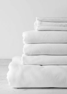 white sheets stacked on top of each other