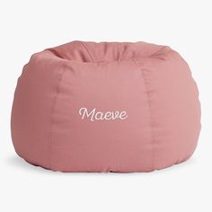 a pink bean bag chair with the word maeve written on it in white ink