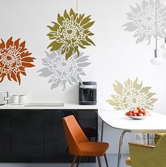 an image of a kitchen setting with flowers on the wall and dining room furniture in the foreground