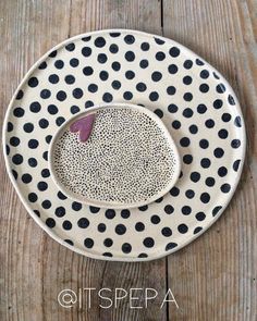 a polka dot plate on a wooden table