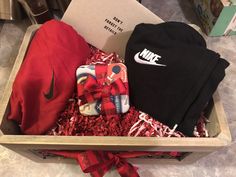 an open box filled with nike clothing and other items