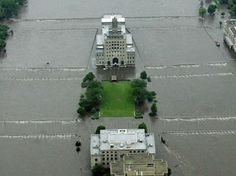 an aerial view of flooded streets and buildings