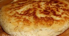 a close up of a bread on a cutting board