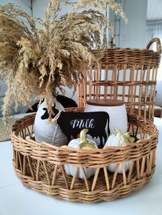 a wicker basket filled with decorative items