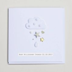 a baby shower card with gold stars and clouds on it's white back ground