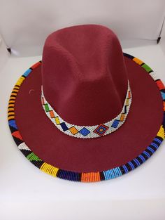 Hand beaded fedora  hat ,an item of quality and good taste .High end fashion statement,light ,multi-colors beads of African taste ,can be worn on several occasions like wedding,birthday ,summer ,spring seasons.Its unisex piece of art and also a great gift . Birthday Summer, Statement Lighting, Fedora Hat, High End Fashion, Hand Beading, Shawls And Wraps, Kenya, Fedora, Fashion Statement