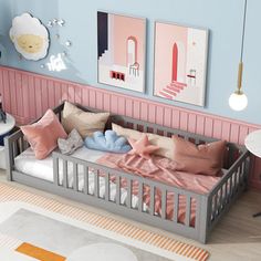 a child's bedroom with pink and blue walls