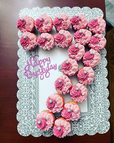 cupcakes are arranged in the shape of a heart